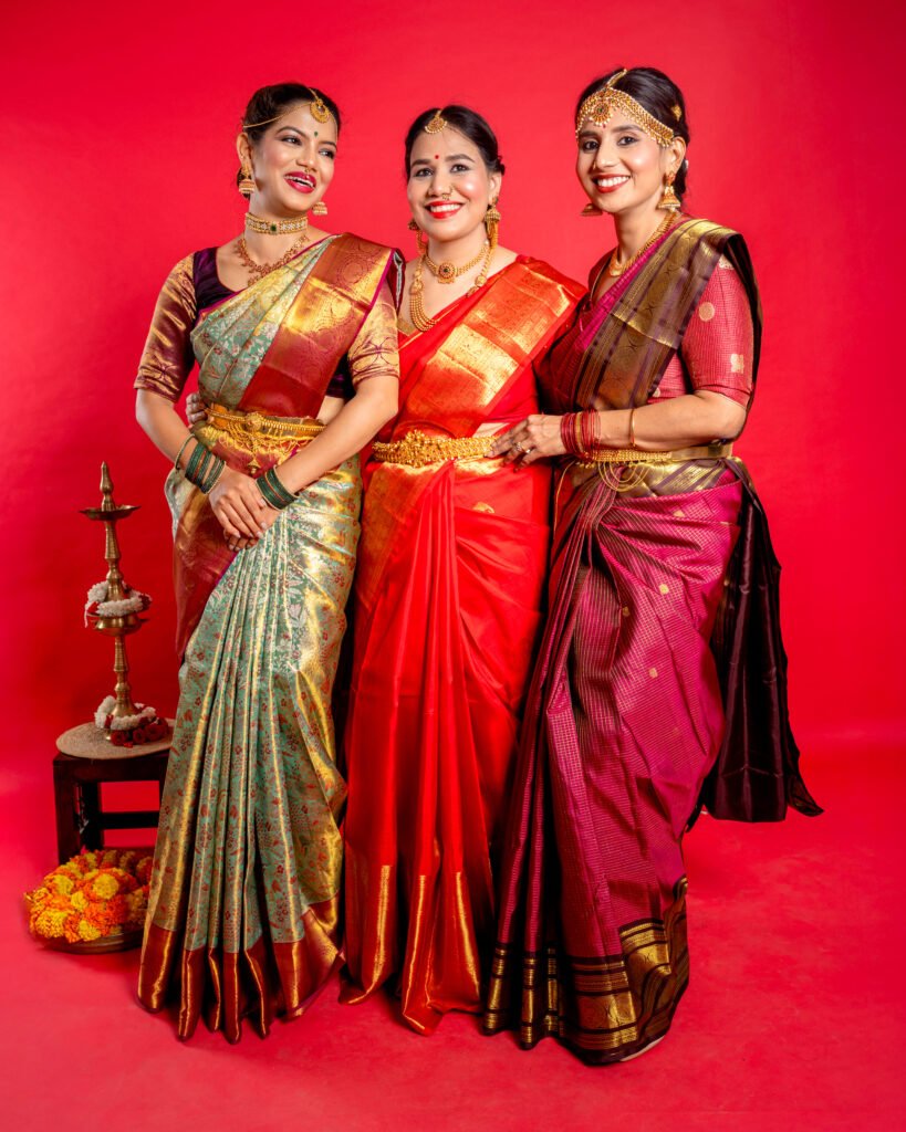 Group of models wearing vibrant Shrivvi Sarees from the festive collection, photographed by Urbanpixelites.